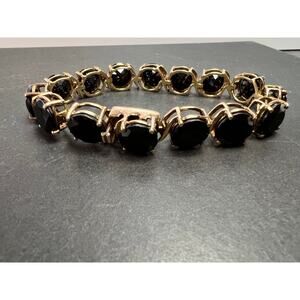 Black spinel tennis bracelet in gold over sterling silver